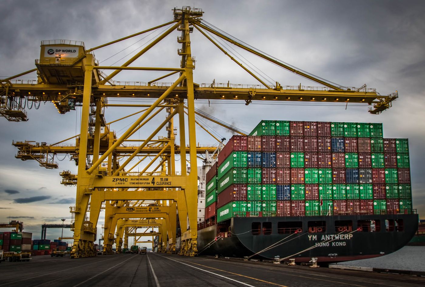 DP World container terminal with cranes and a docked ship